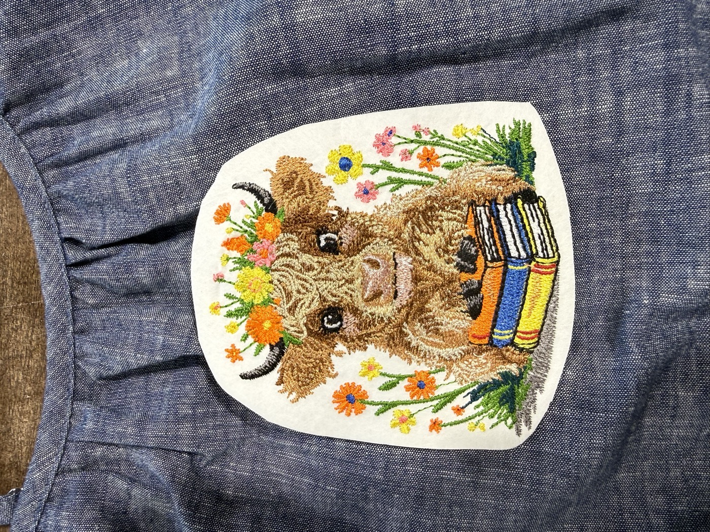 Custom embroidered animal design with floral border